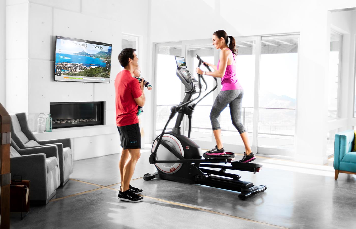 woman on elliptical in family room